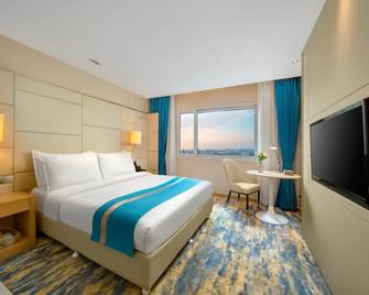 Wanda Holiday Hotel (Harbin Central Avenue) - هاربين - غرفة نوم