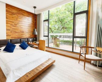 Xichang Shuxia Hotel - Liang-šan - Ložnice