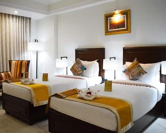 Green View by Green Tree Hotels - Rishikesh - Schlafzimmer