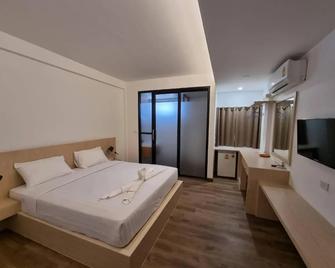 Pimann Place Hotel - Chiang Rai - Ložnice