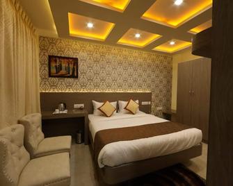 Aaccord Suites Inn - Bengaluru - Bedroom