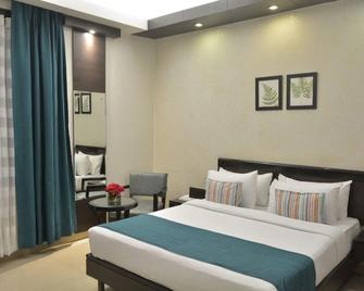 Hotel Rockland Panchsheel Enclave - New Delhi - Bedroom