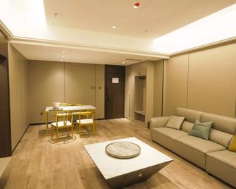 Wenxi Taoyuanli Xinyuan Hotel - يونتشنغ - غرفة معيشة