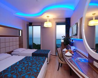 Grand Zaman Beach Hotel - אלניה - חדר שינה