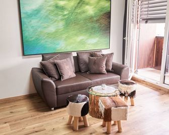 Kitzhome City Apartments - Kitzbühel - Wohnzimmer