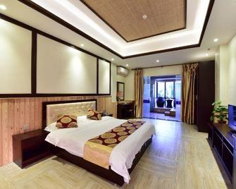 Linyu Huaxi Hot Spring Holiday Hotel - Zhangzhou - Bedroom