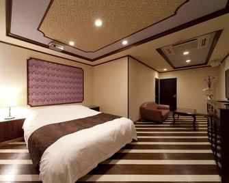 Hotel Fine Garden Matsuzaka III - Matsusaka - Schlafzimmer