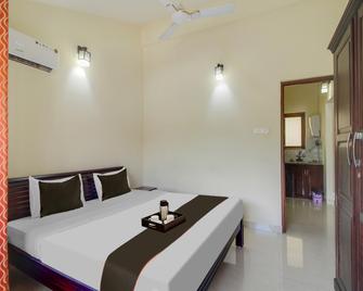 Capital O Varca Holiday Suites - Varca - Schlafzimmer