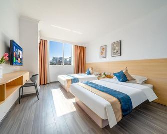 Jun'an Convenience Hotel (Chaoyang Square Nanning Railway Station) - Nanning - Bedroom