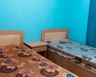 Utopia Youth Hostel - 西双版纳傣族自治州 - 臥室