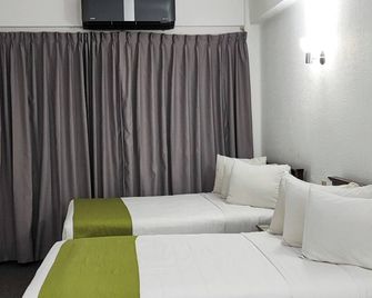 Capital O Hotel Florida Tuxpan - Tuxpan - Bedroom