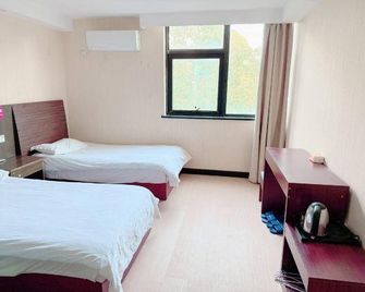 Huile Holiday Hostel - Shanghai - Chambre