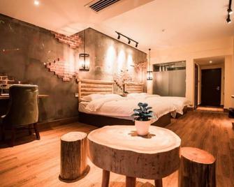 Zhangjiajie Interval Time Travel Inn - ג'אנגג'יאיי - חדר שינה