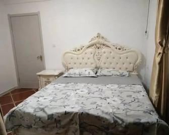 Weihai Haina Holiday Apartment - Weihai - Schlafzimmer