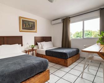 Cinco Hotel B&B - San Salvador - Schlafzimmer