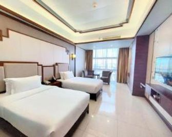Wanguo Metropolitan Plaza Hotel - Haikou - Bedroom