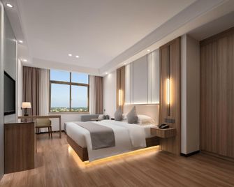 Meet Joy Yuyue Hotel (Wanning High-Speed Railway Station) - Wanning - Ložnice