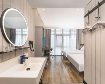 Hanting Hotel Nantong Yongxing - נאנטונג - חדר שינה