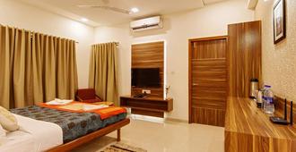 Hotel Woodland Kolhapur 3 Star Hotel - Kolhāpur - Bedroom