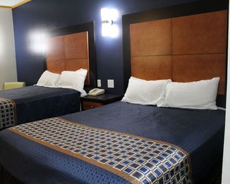 Home Gate Inn & Suites - Southaven - Makuuhuone