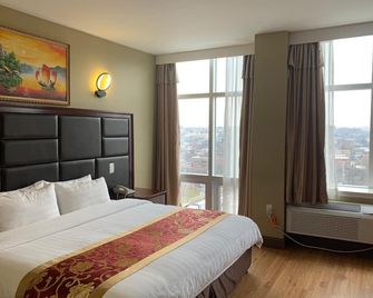 فندق كوينز - كوينز - غرفة نوم