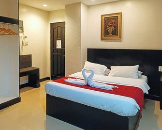 Check Inn Hotel Dumaguete City by RedDoorz - Dumaguete - Camera da letto