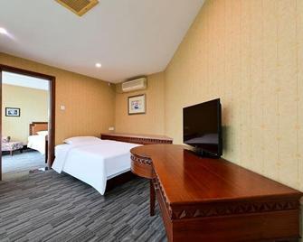 Zhongshan Sunshine Business Hotel (Zhongshan Pedestrian Street Xingzhong Plaza Store) - Zhongshan - Slaapkamer