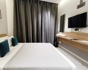 Hotel Kant by GoHotels - Near Shree Dwarkadhish Temple - Dwārka - Schlafzimmer