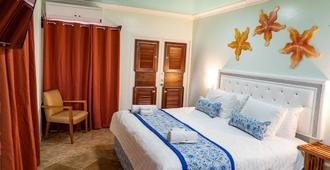 Island Magic Beach Resort - Caye Caulker - Bedroom