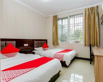 Shunli Tree Business Hotel - Leshan - Camera da letto