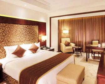 Anandha Inn Convention Centre and Suites - Pondicherry - Phòng ngủ