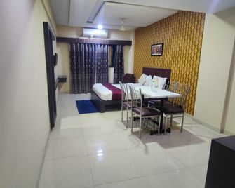 Hotel Anand Inn - Vapi - Schlafzimmer