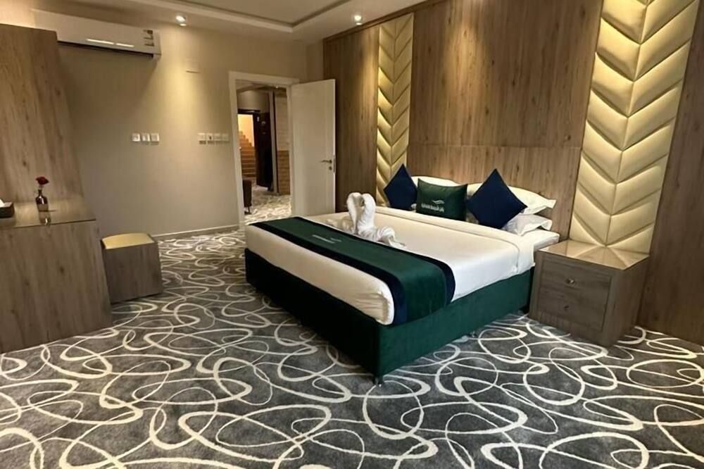 أجنحة صن رايز الفندقية - تبوك - غرفة نوم