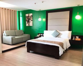 Coron Gateway Hotel & Suites - Coron - Phòng ngủ