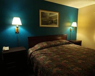 Magnolia Bay Hotel & Suites - Jonesboro - Bedroom