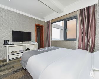 Twins International Apartment - Guiyang - Schlafzimmer