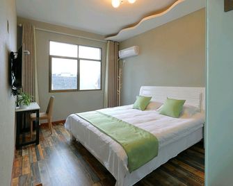 Huangshan Meet Inn (High-speed Railway North Station Branch) - Huangshan - Bedroom