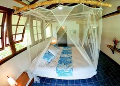 Fare Oviri Lodge - Uturoa - Schlafzimmer