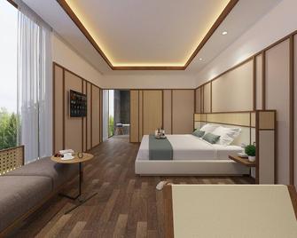 The Allure Villas Managed by Sahid - Pangandaran - Schlafzimmer