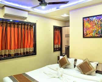 Reliable Inn - Kolkata - Schlafzimmer