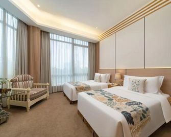 Zhanjiang Jinfu Auto Theme Hotel (Jinshawan Guanhai Long Corridor) - Zhanjiang - Habitación