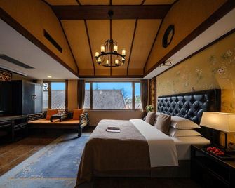 Share Year Hotel - Lijiang - Habitación