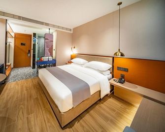 E Wan Business Hotel - Wanning - Ložnice