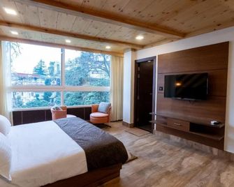 Wisteria Chalet - מוסורי - חדר שינה