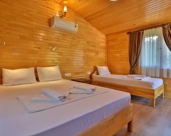 Ugur Pansiyon Çirali - צ'יראלי - חדר שינה