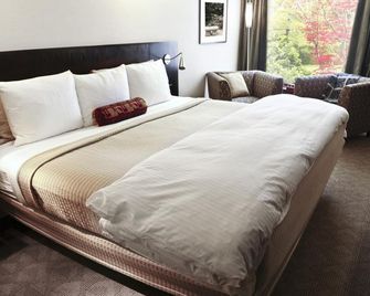 Srinidhi Grand Inn - Bengaluru - Schlafzimmer