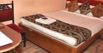 Hotel Kamal - Nagpur - Camera da letto