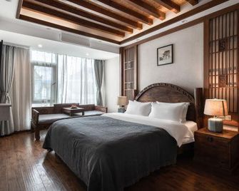 Lijiang Sinkoo Hotel - ליז'יאנג - חדר שינה