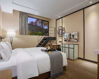 Qingmou Hotel (Nanping Store) - Trùng Khánh - Phòng ngủ