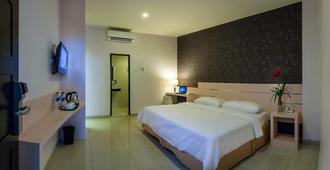 Cordela Hotel Medan - Medan - Habitación